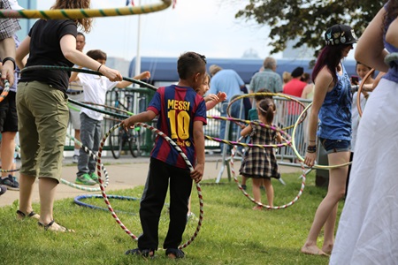 Attendees hula-hooping at River Festival