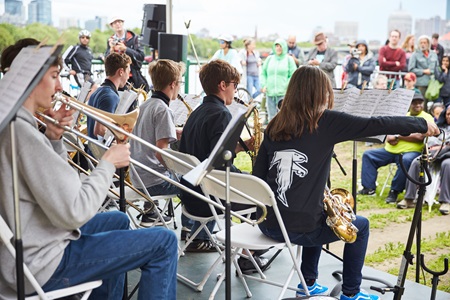 The Cambridge Rindge school band plays to a crowd