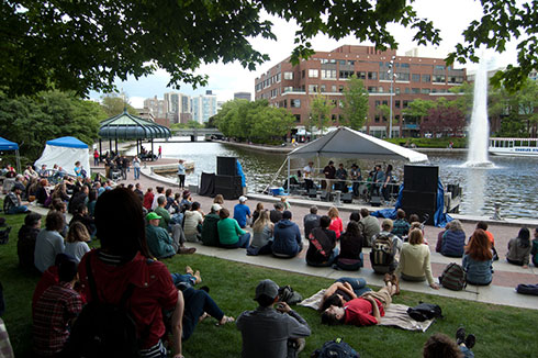 Bands play on the floating stage in the Lechmere Canal during the 2017 River Festival.