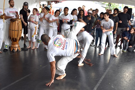 Mandinguerios dos Palmares Capoeira demonstrate the Brazilian mix of martial arts, dance and music on the Interactive Dance Stage at the 2019 Cambridge Arts River Festival.