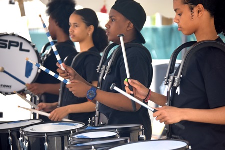 The Putnam Avenue Upper School Drumline performs on the Youth & Family Stage at the 2019 Cambridge Arts River Festival.
