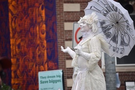 Snow, Living Statue performs on Massachusetts Avenue during the 2019 Cambridge Arts River Festival.