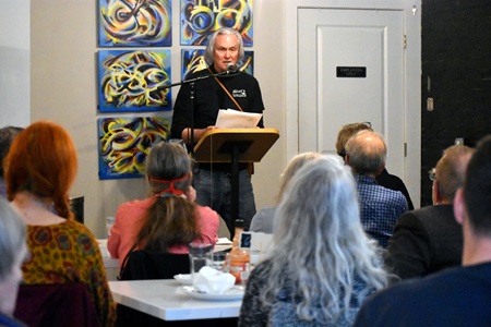 Luke Salisbury speaks at the  City Night Readings Series at The Little Crêpe Café in Cambridge, May 6, 2022.