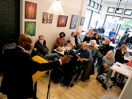 Jean-Dany Joachim speaks at the  City Night Readings Series at The Little Crêpe Café in Cambridge, May 6, 2022.