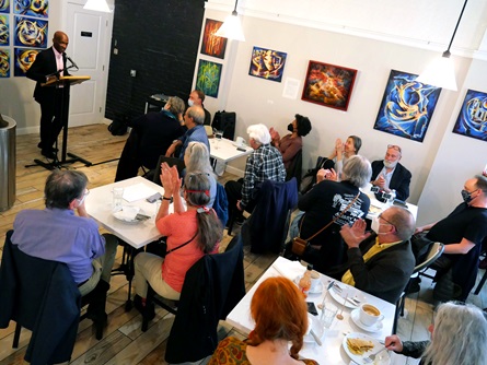 Jean-Dany Joachim speaks at the  City Night Readings Series at The Little Crêpe Café in Cambridge, May 6, 2022.