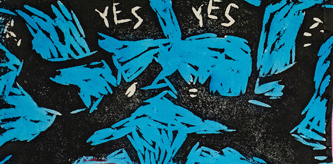 People waiving flags reading "Yes" while riding horses.