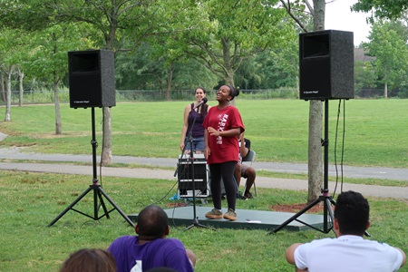 Student performing their poems at event