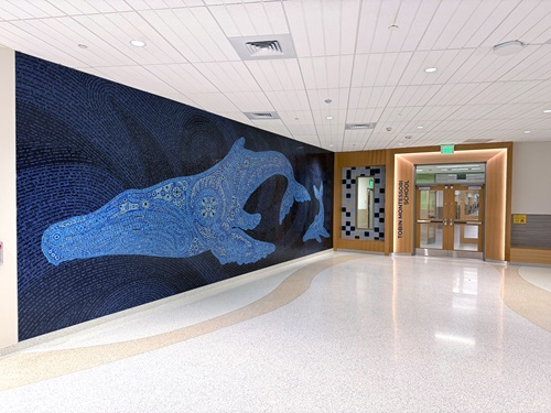 “Tranquility” by Andromeda Lisle. Large-scale mosaic of a humpback whale and calf symbolizing care and connection. Photo by Cambridge Arts.
