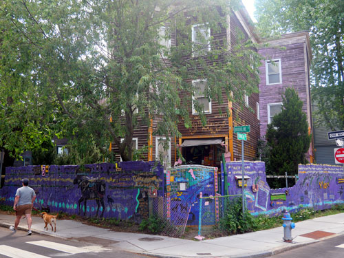 Peter Valentine’s “Cosmic Moose and Grizzly Bear’s Ville” fence at Franklin and Brookline streets.