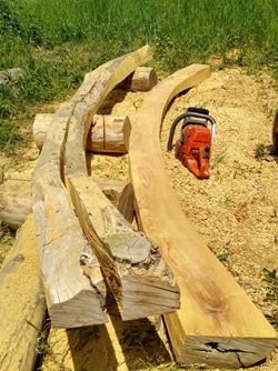 Lumber that Cambridge artist Mitch Ryerson is shaping for the Sensory Hilltop he and his team are creating for the Universal Design Playground at Cambridge's Danehy Park, 2021. (Courtesy Mitch Ryerson))