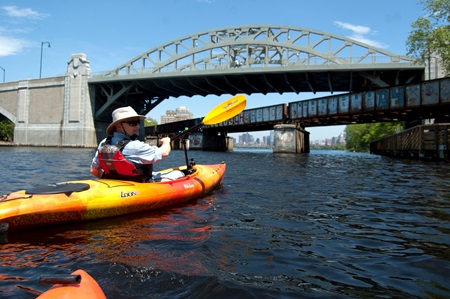 Photographer Richard Hackel approaches the BU bridge along the Charles River.