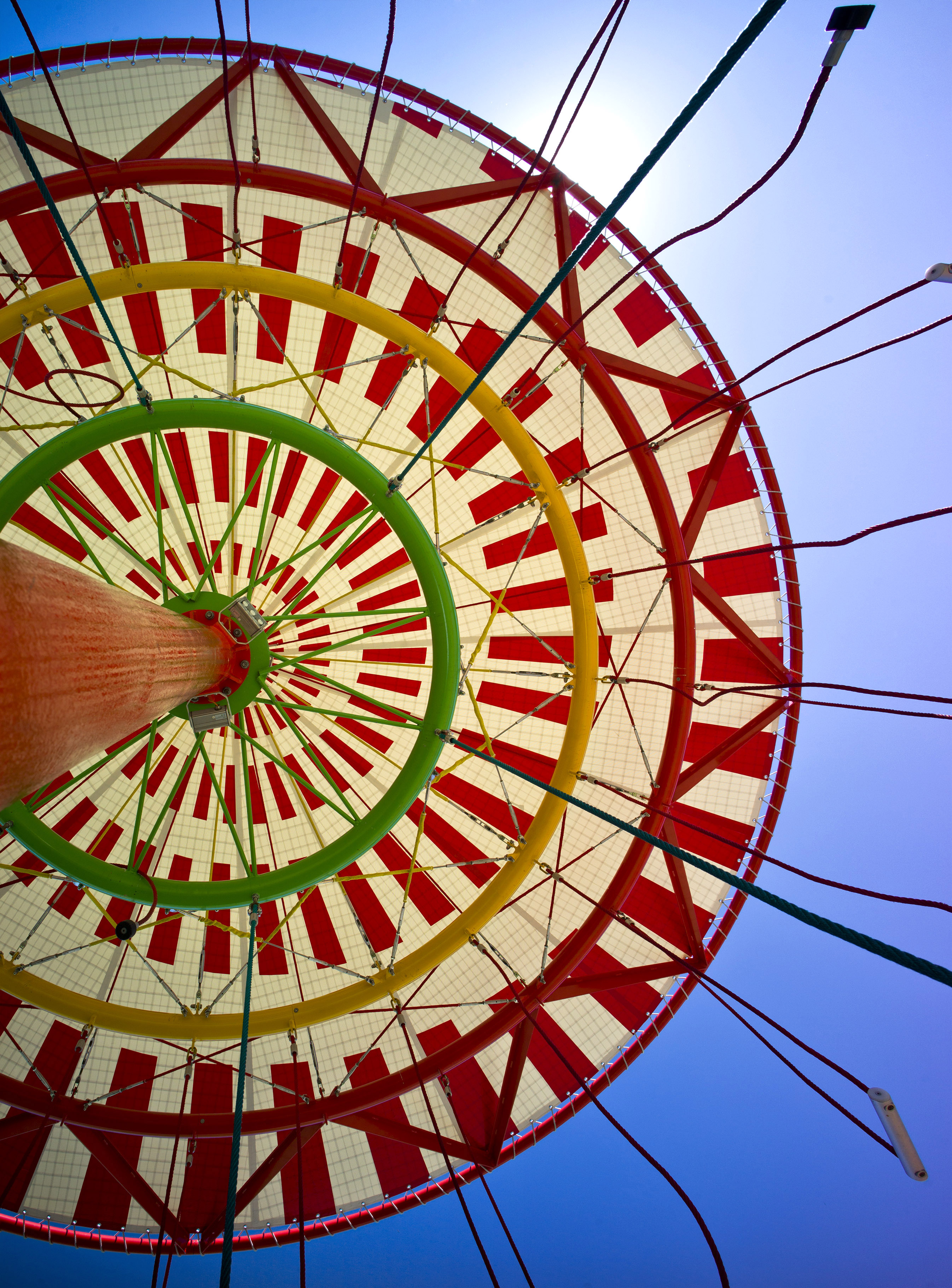View from below an energy carousel looking towards the sky
