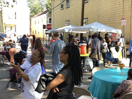 Photo of Cambridge residents conversing and enjoying a Meet Your Neighbor Day event