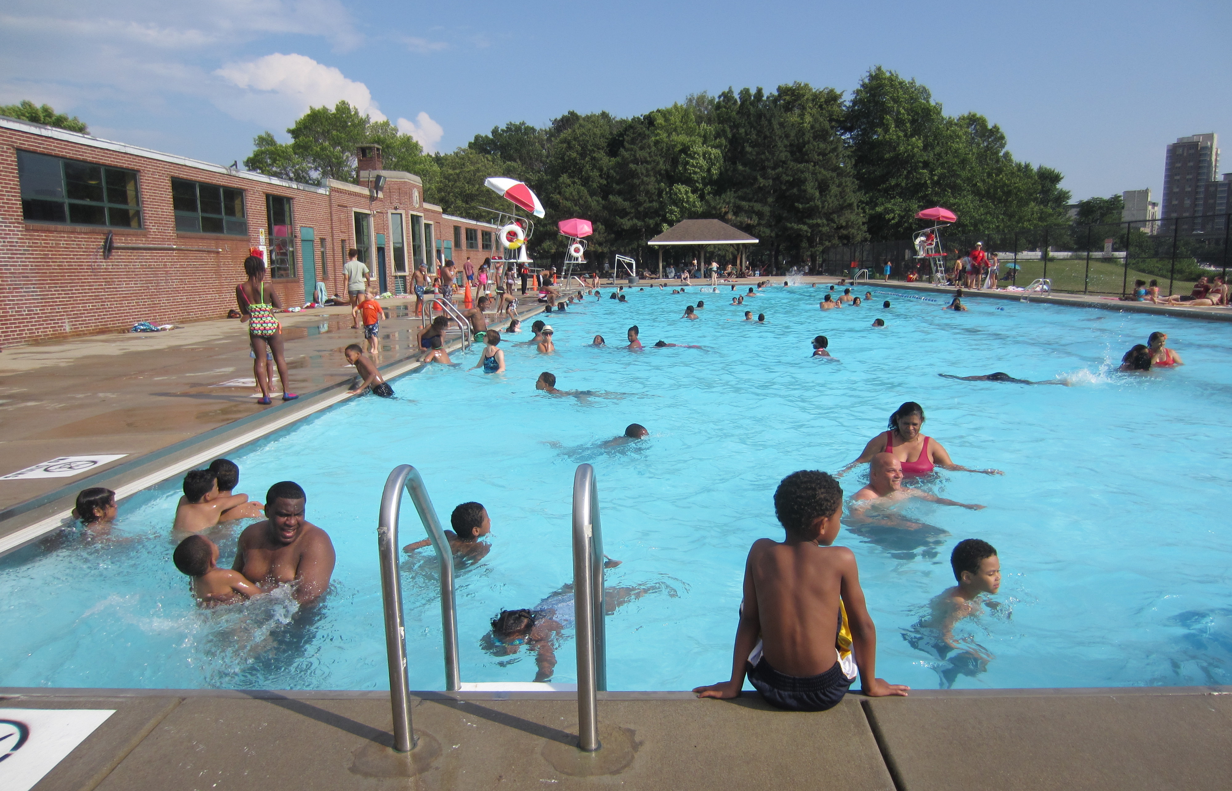 People swimming in one of Cambridge's pools. This is the top-most image in the story map linked in the caption.