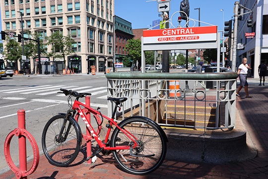 Bicycle parked in front of Central Square T Station on Red Line