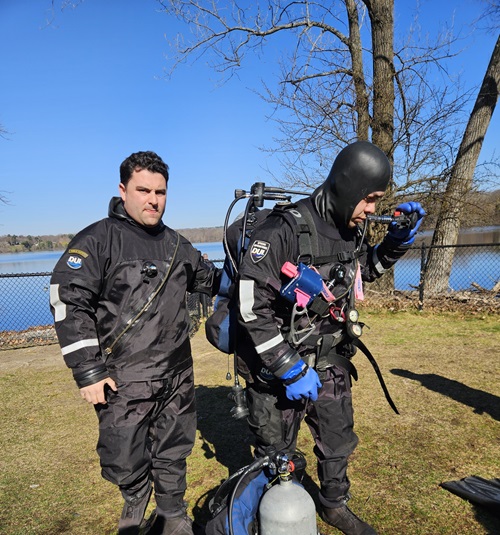 Firefighter divers preparing to enter the water for a dive training exercise