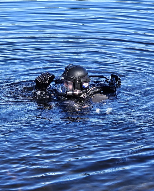 firefighter diver in the water