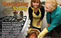 Thanksgiving Fire Safety image of two people pulling turkey from oven