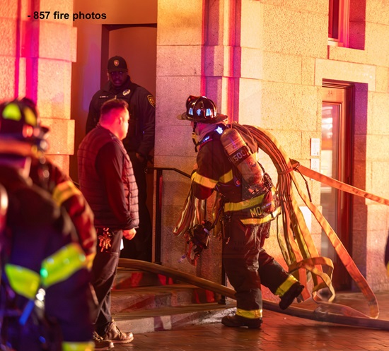 Engine 5 Firefighter stretching an attack line to the fire on floor 4 at 53 Bow Street
