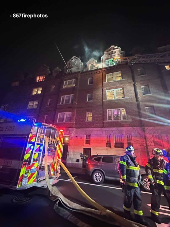 Engine Company 1 pump on Bow Street with hose lines being deployed to the fire on flloor 4