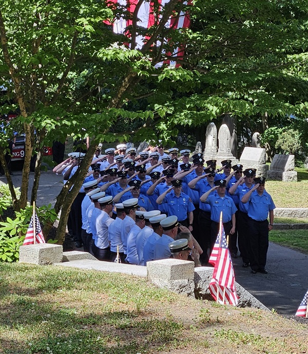 Firefighters Memorial Sunday - June 14, 2026 - Firefighters at attention with hand salute