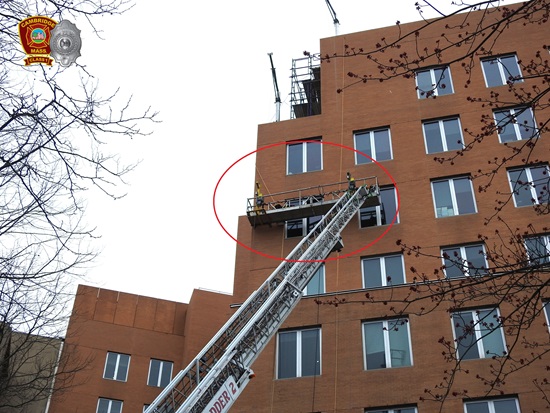 Ladder 2 with the aerial ladder deployed to high-rise building with construction workers trapped in a disabled scaffolding - Mar302026