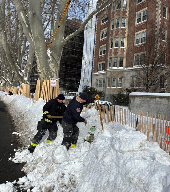 Ladder 1 firefighters clearing snow from a hydrant - January, 2026