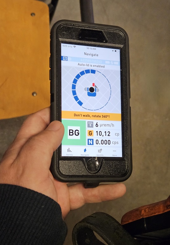 a phone app connected to a radiation sensing device testing for ambient radiation