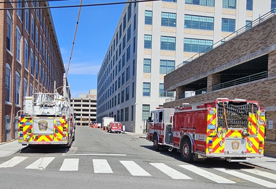 The apparatus of Engine 5, Ladder 3, & Squad 2 parked on the street during the radiation training review