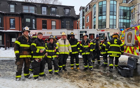 2nd alarm box 2-461 - 1137 Mass Av - group of firefighters after fire has been extinguished