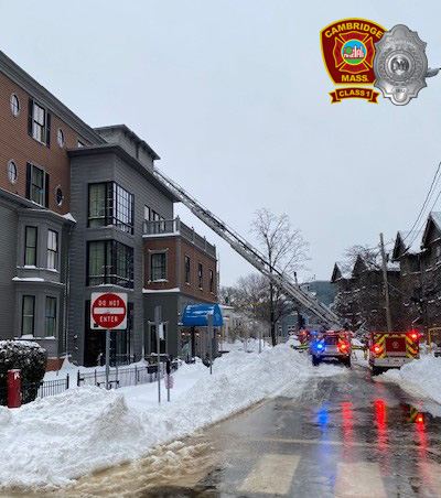2nd alarm box 2-461 - 1137 Mass Av - Ladder 2's aerial device deployed to the Remington St side of the fire