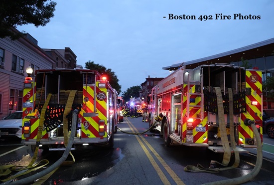 Engine s 5 and 1 with hose deployed to the working fire at 803 Cambridge st