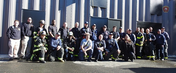 group photo of Cambridge fire companies in Brookline training