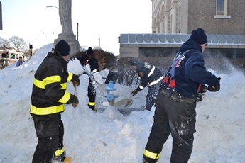 firefighters shoveling out hydrants