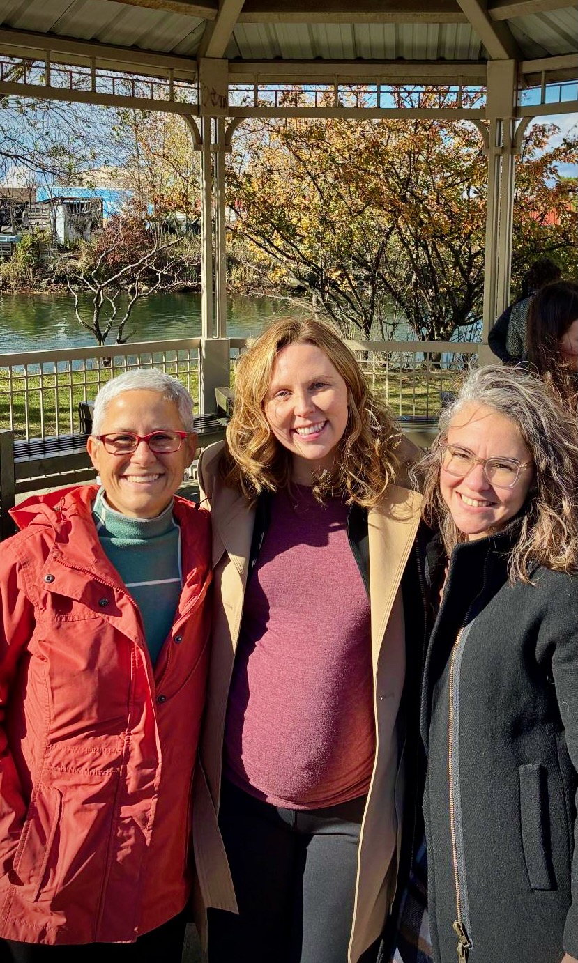 Cambridge Climate Chief Julie Wormser (left) joins Deanna Moran, Chief Coastal Resilience Officer in the Massachusetts Office of Coastal Zone Management, and (right) Jill Valdes Horwood, Massport Chief Climate and Resilience Officer, at the official release of the ResilientCoasts Plan in Chelsea.
