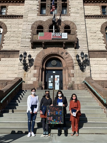 Photo of Mayor Siddiqui with winners of the Women's History Month art contest