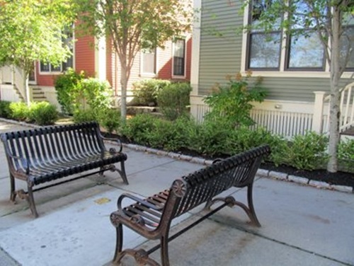 ocial benches and a temporary shade structure from past Cambridge programs.