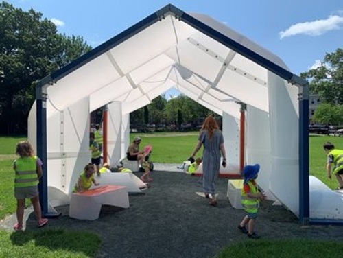 ocial benches and a temporary shade structure from past Cambridge programs.