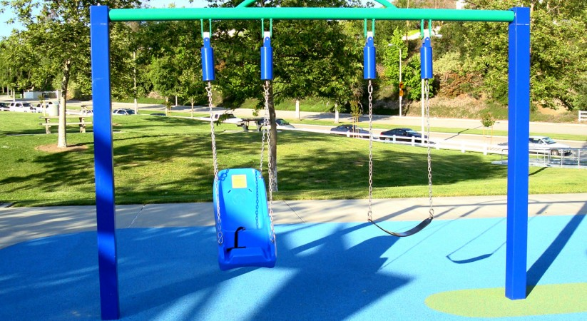 "Sympathetic" swingset; the swing on the left moves in time with the swing on the right