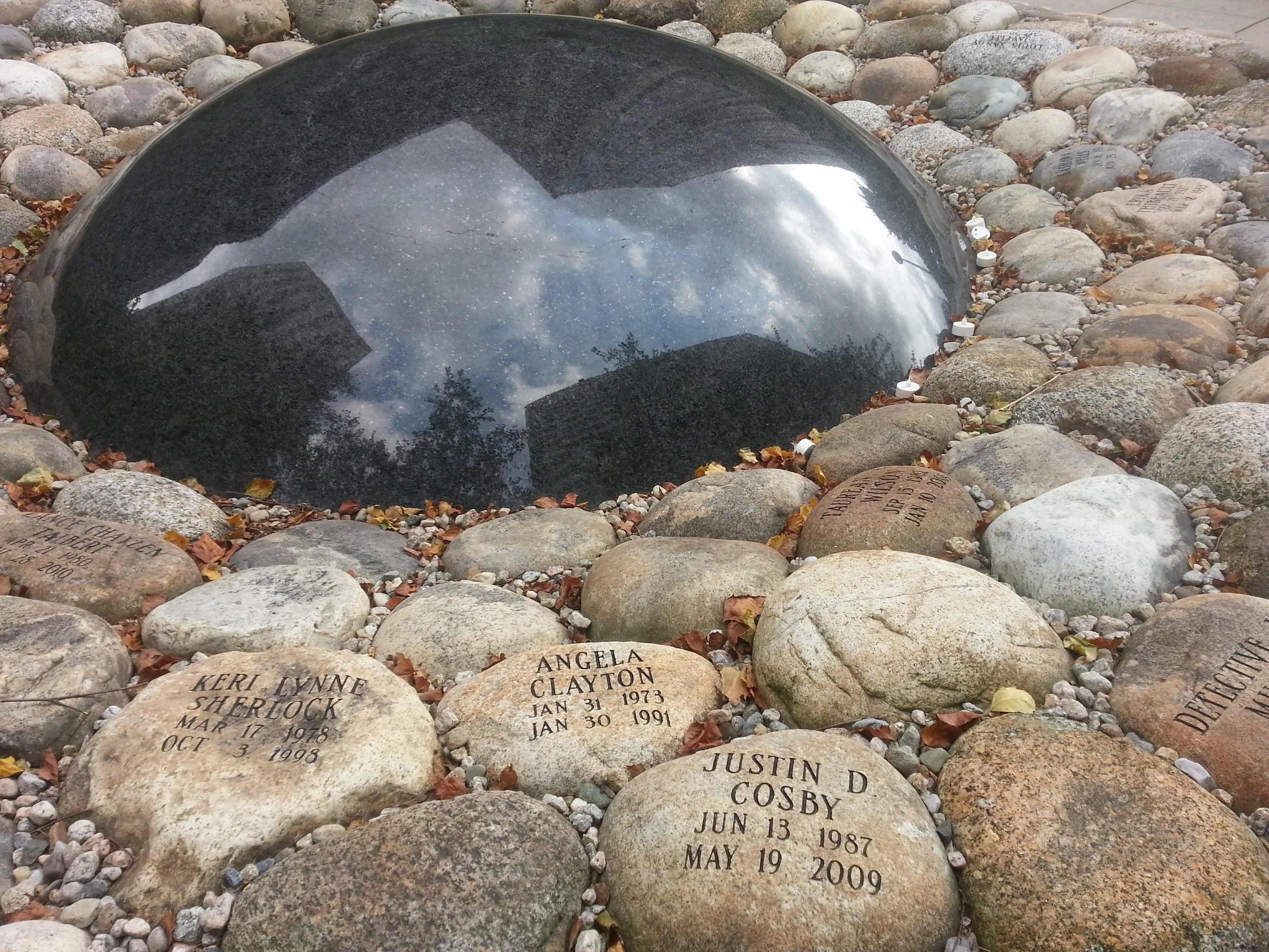Stones with names of those lost to violence