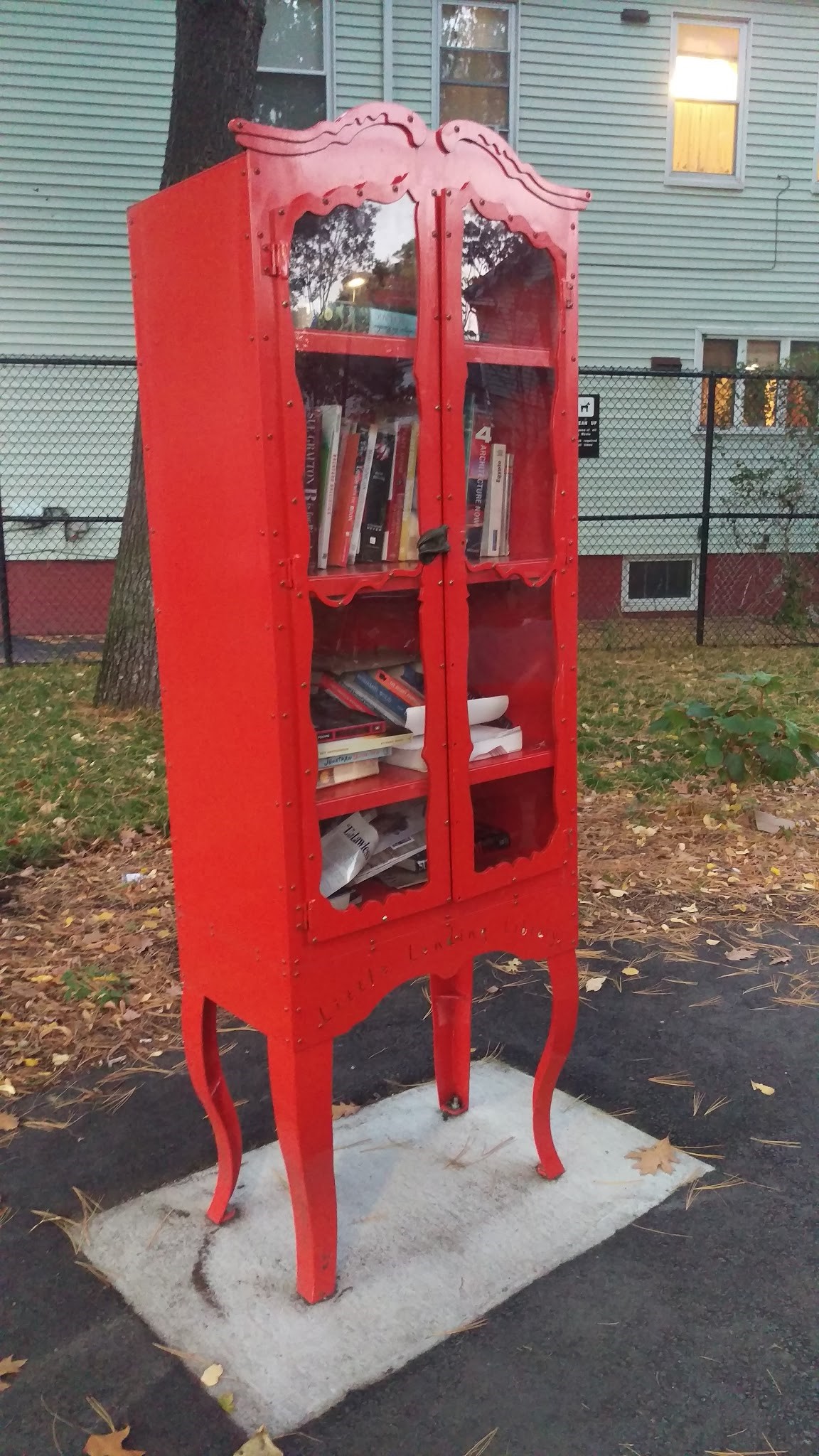Little Free Library kiosk designed to look like a wardrobe