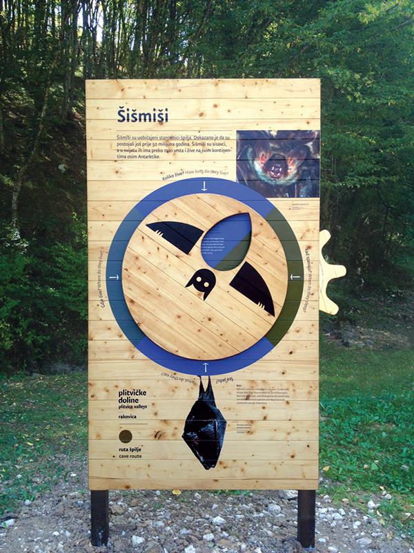 Wooden sign in Croation describing bats