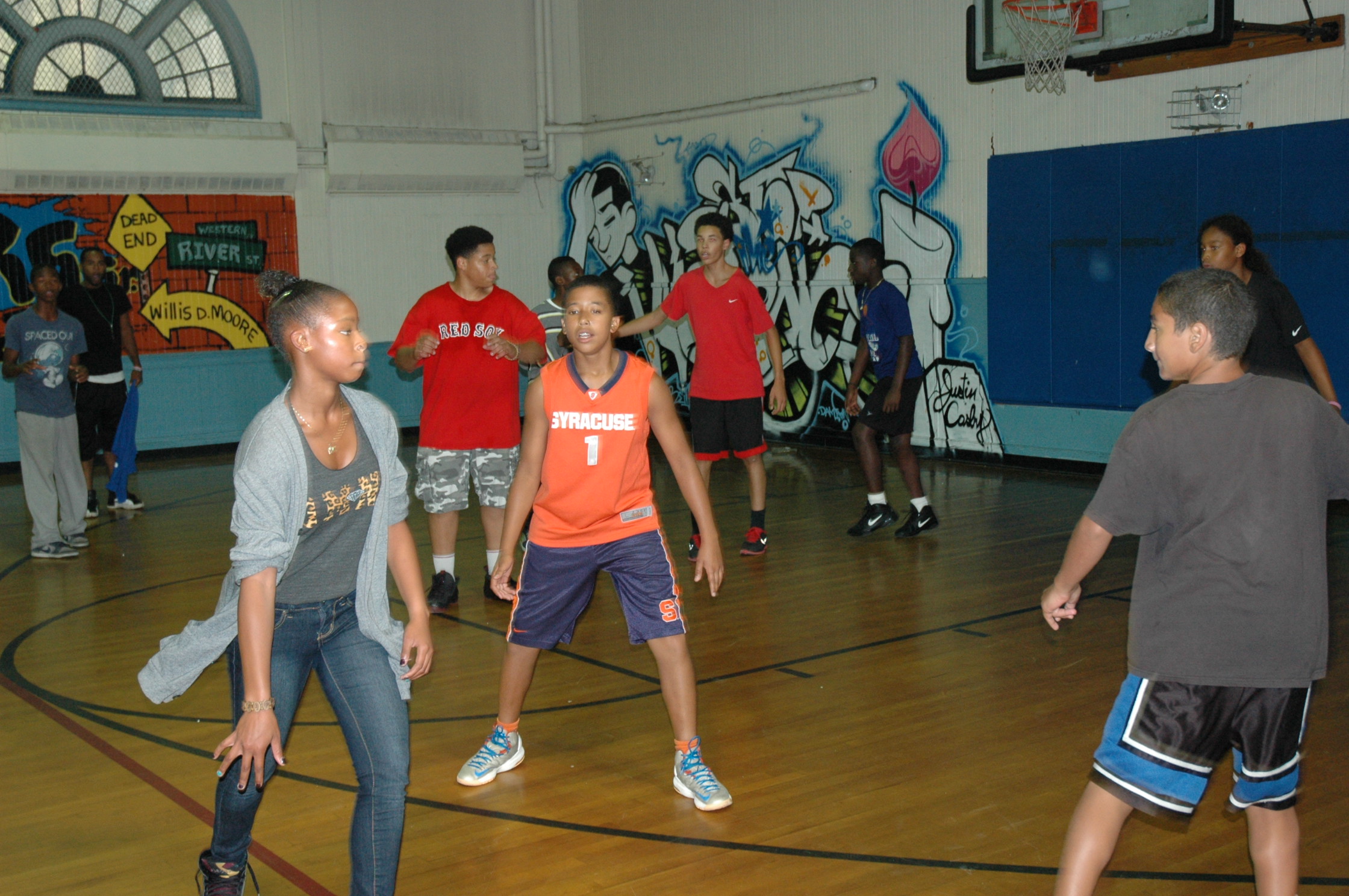 Kids on the basketball court at the Moore Youth Center