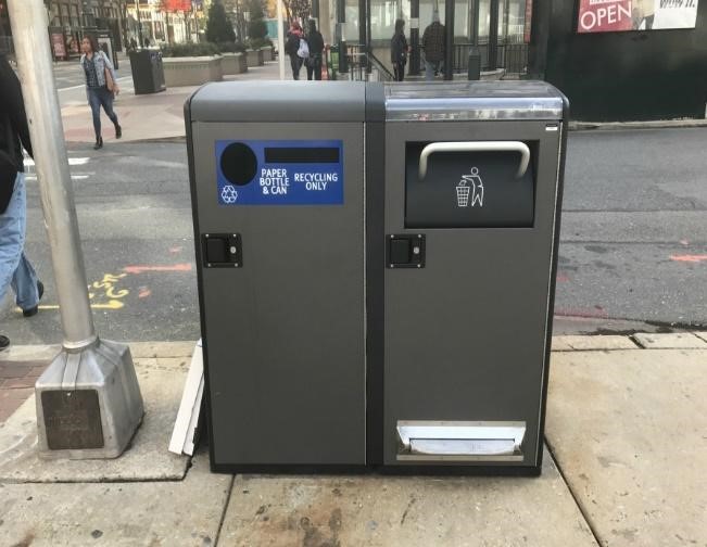 Big Belly trash and recycling compactors on a sidewalk