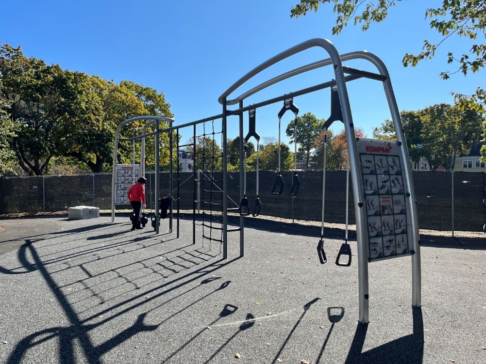 An outdoor structure with various climbing, stretching, and other apparatuses.