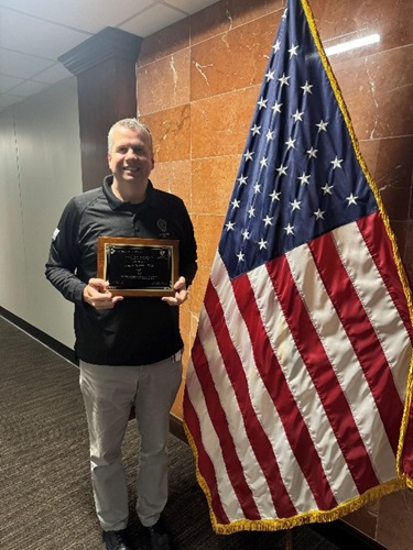 Dr. Barrett with award