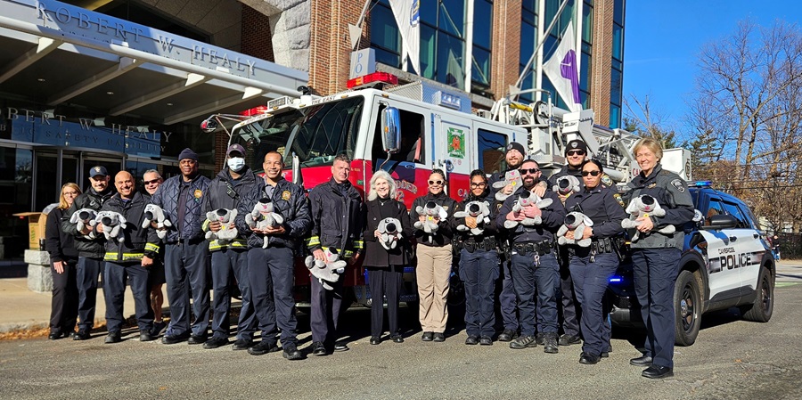 Members of CPD and CFD accept donation of Trouble Dogs from Sheila Duncan of The Kennek Foundation