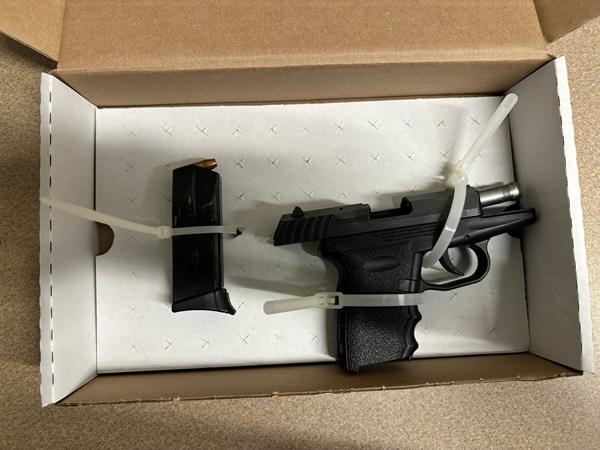 Firearm and magazine recovered during the arrest. 