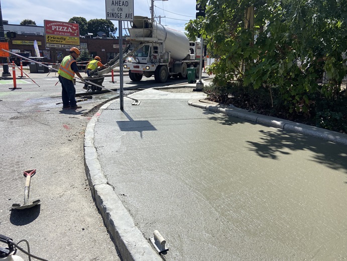 New concrete sidewalk at Mass Ave and Cedar St