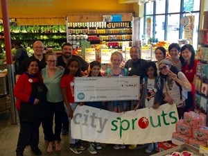 Students in CitySprouts program with Whole Foods staff.  Photo courtesy of CitySprouts.